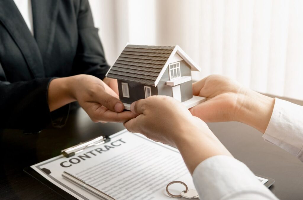 Scotty Cash Buys Houses agent finalizing a contract with a homeowner in Cabot, AR, showing reliability and trust in cash home buying services. Cash Home Buyers near me.