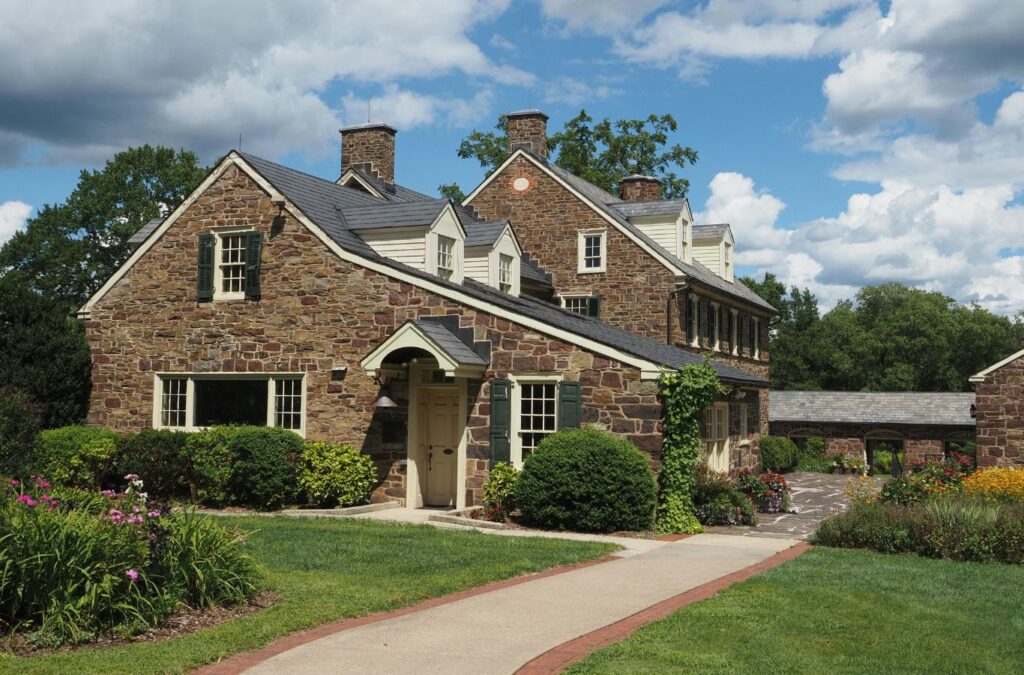 A Scotty Cash Buys Houses team member evaluating a property in Fort Smith, AR to provide a fast and accurate cash home offer using professional tools.